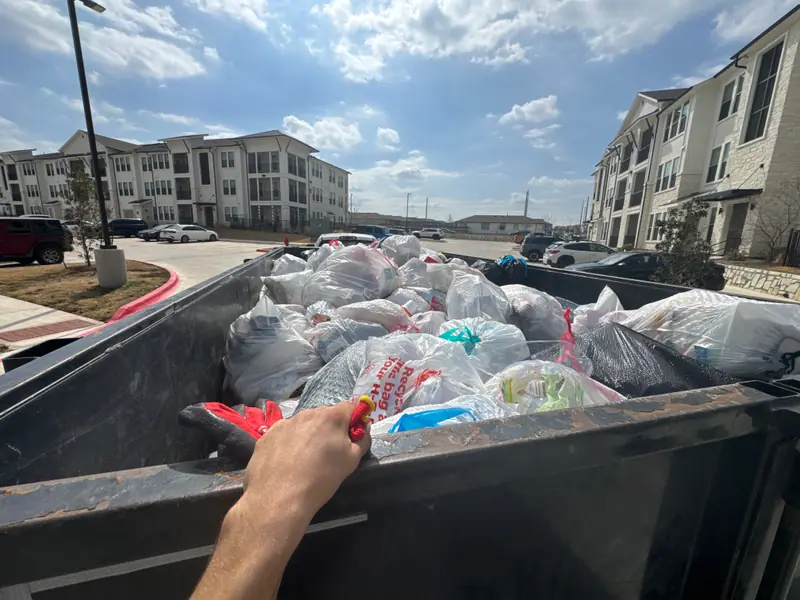 Loaded trailer of bagged apartment trash ready to haul