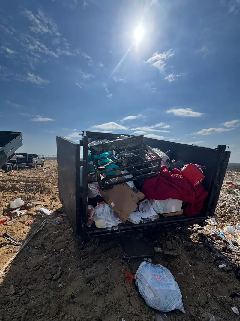 Dump trailer tipping a load at the Guadalupe County landfill working face